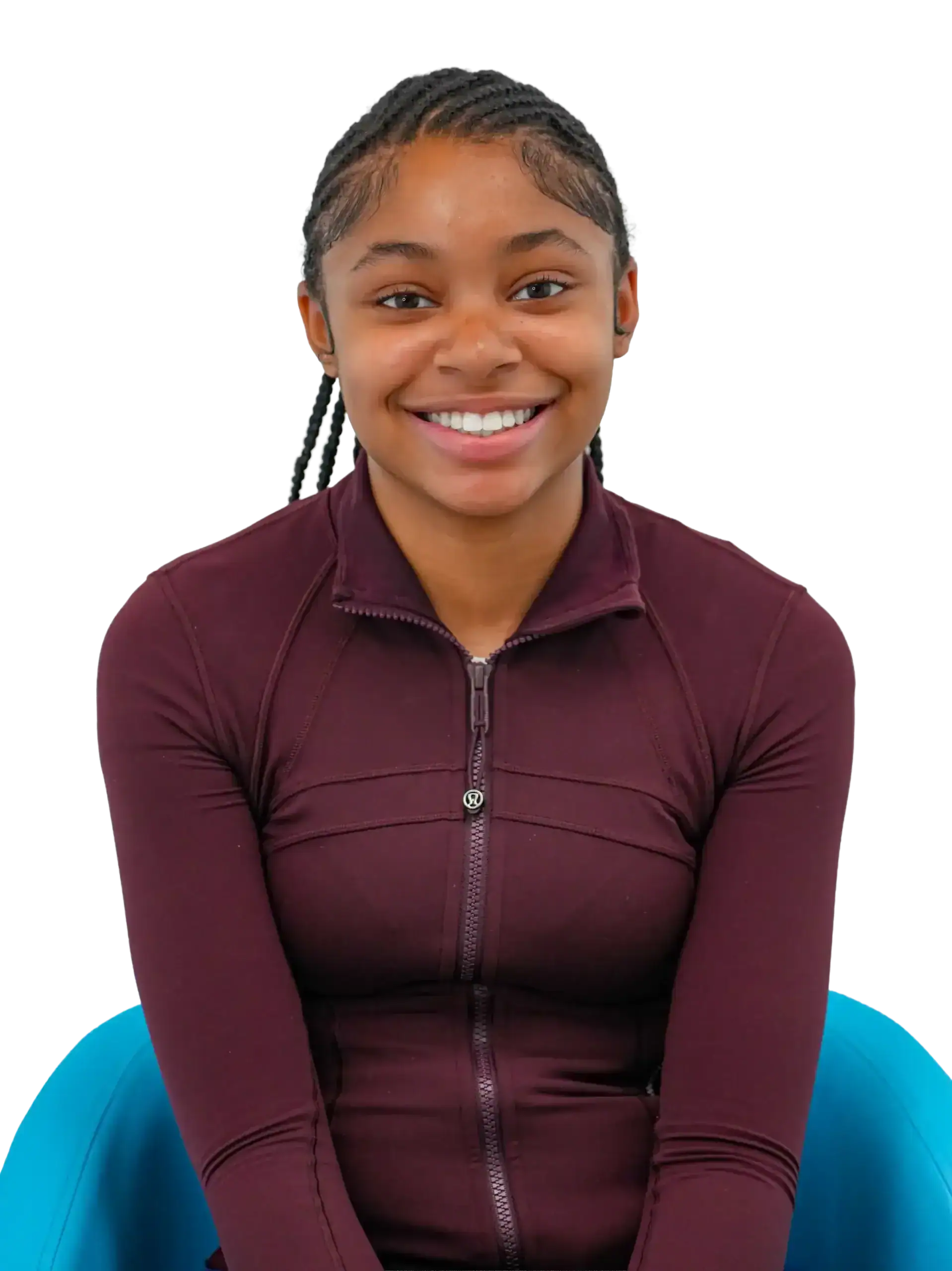 Young girl with braces smiling, showcasing orthodontic treatment success.