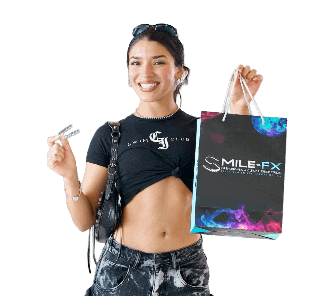 Smiling woman holding orthodontic tools and a SMILE-FX bag.