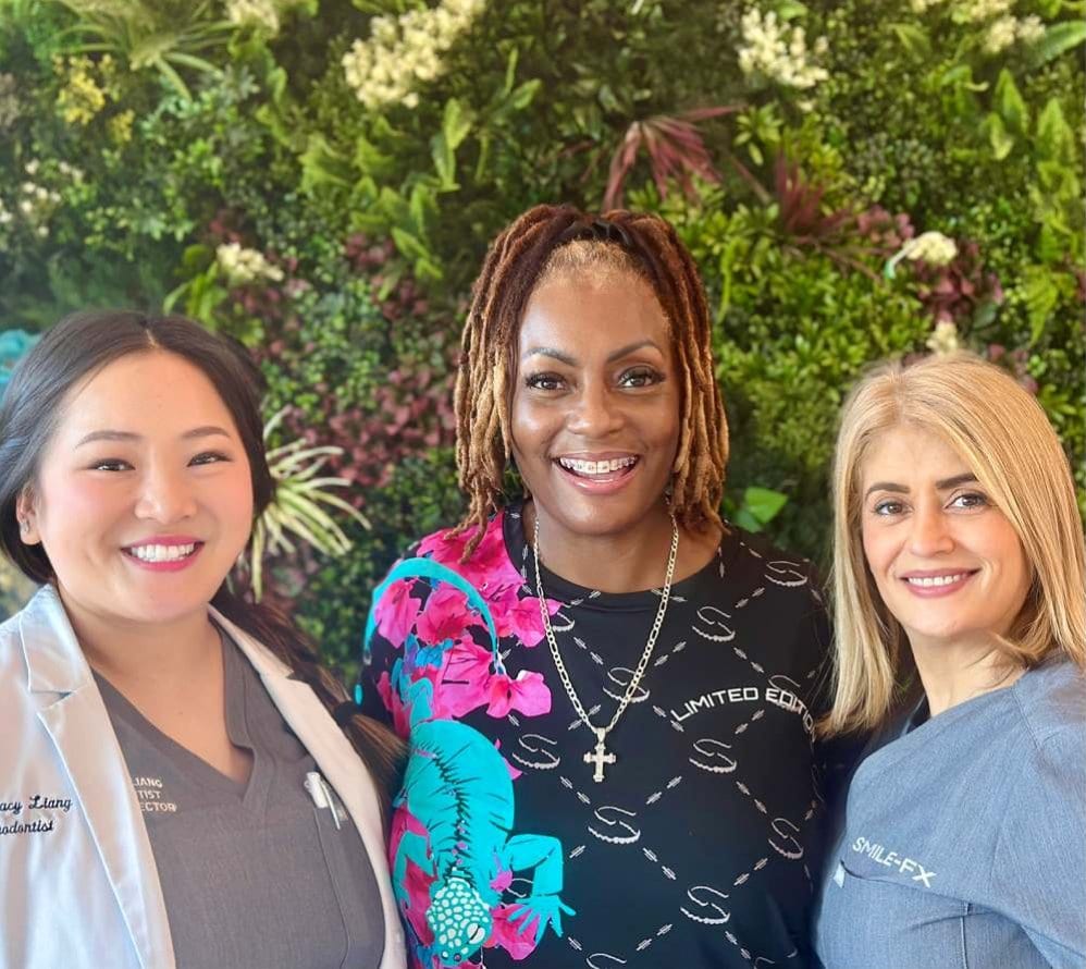 Smiling patients at SMILE-FX Orthodontic & Clear Aligner Studio.