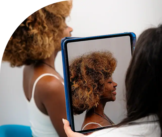 Woman's profile reflected in a mirror during orthodontic consultation.